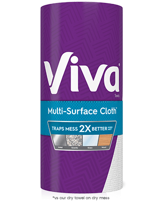 A roll of Viva Multi-Surface Cloth Paper Towels on a white background. The label reads "Traps mess 2X better." Text at the bottom of the image reads: "vs our dry towel on dry mess"